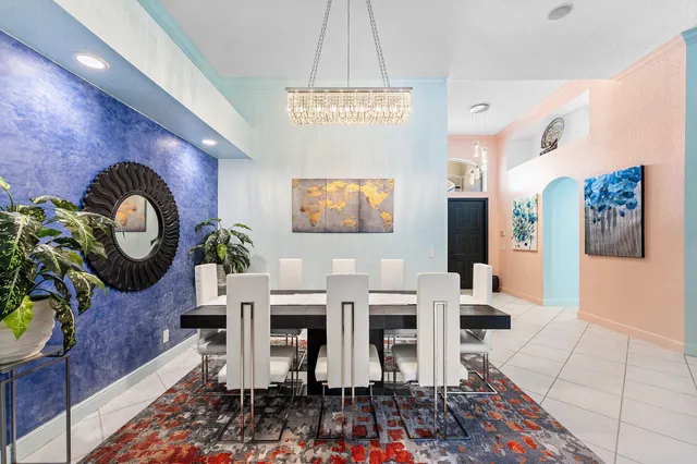 a living room with furniture and a view of kitchen