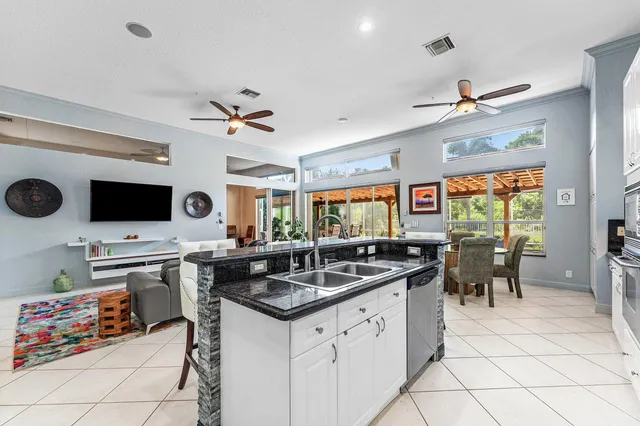 a bathroom with a double vanity sink mirror and a shower