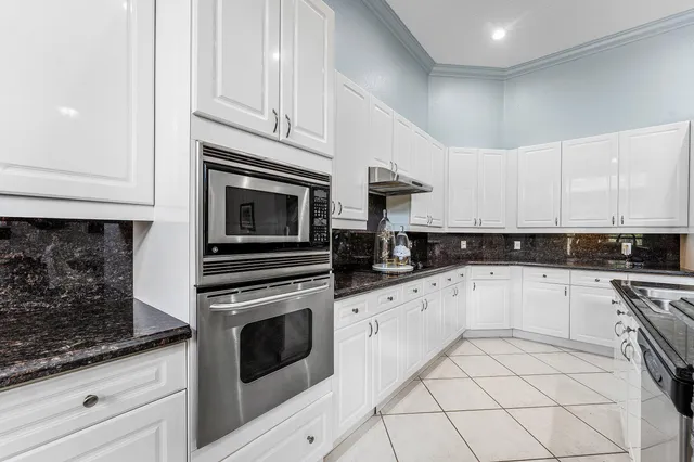 a bathroom with a shower and a sink a mirror