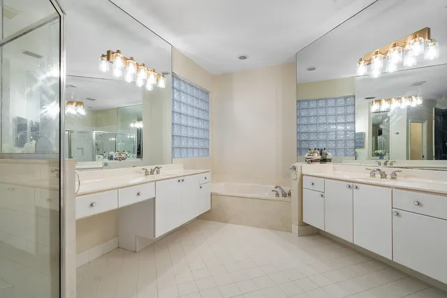 a front view of a house with a garden and yard