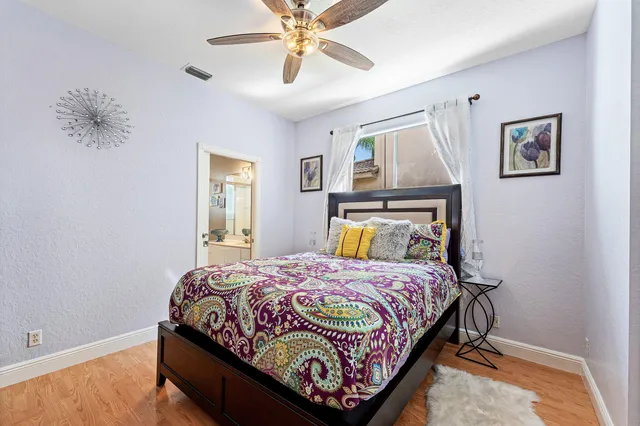 a front view of a house with a garden and patio