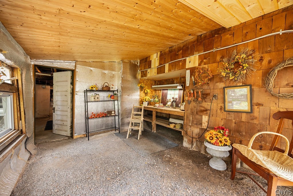 7942 Salt Springs Road Manlius, NY 13104 - Photo 42 of 50 Off the exit door of the basement sits a planting shed. Off the shed a door leads you to the lower level of the estate where you can walk out on level grass & access the basement level of the barn