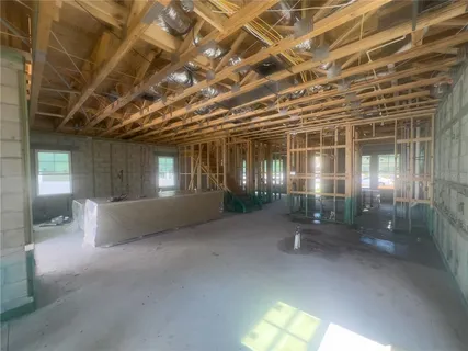 a picture of a room with a white wall and sink