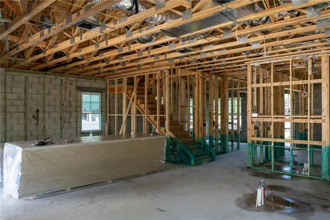 an aerial view of a house with a big yard