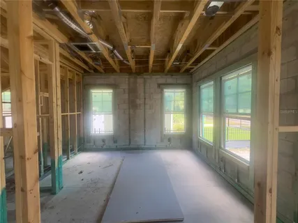 a view of an house with backyard space and garden