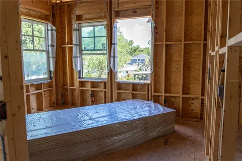 a kitchen with a sink stainless steel appliances and white cabinets