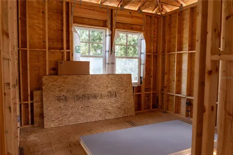 a kitchen with kitchen island granite countertop a stove a sink and refrigerator