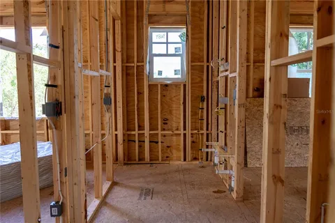 a view of kitchen with sink microwave and stove