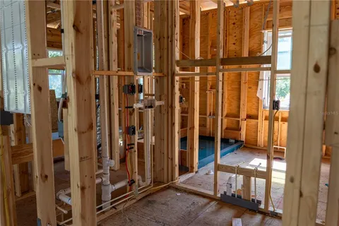 a view of wooden floor and chair in a room