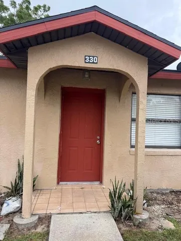 a view of a wooden door of the house