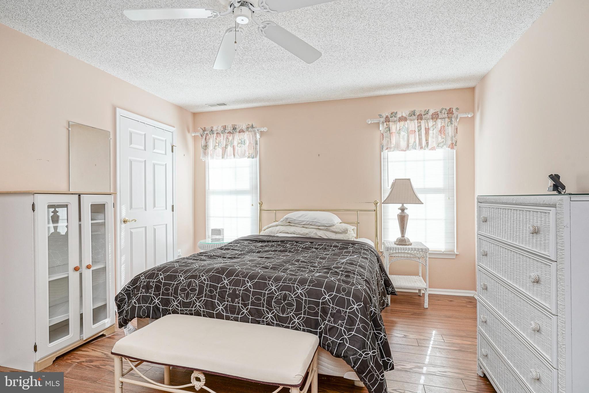 160 Gunwale Road Manahawkin, NJ 08050 - Photo 13 of 27 a bedroom with a bed and a dresser