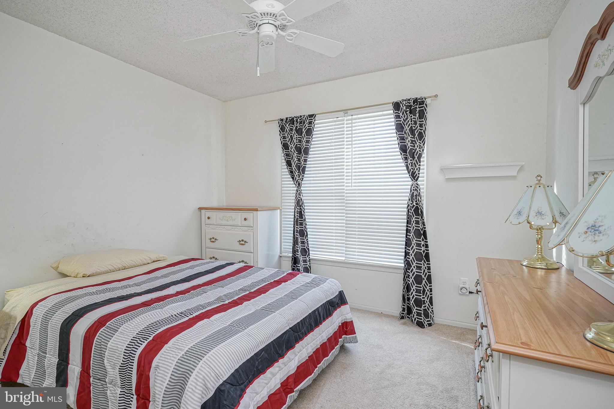 160 Gunwale Road Manahawkin, NJ 08050 - Photo 18 of 27 a bedroom with a bed and a window