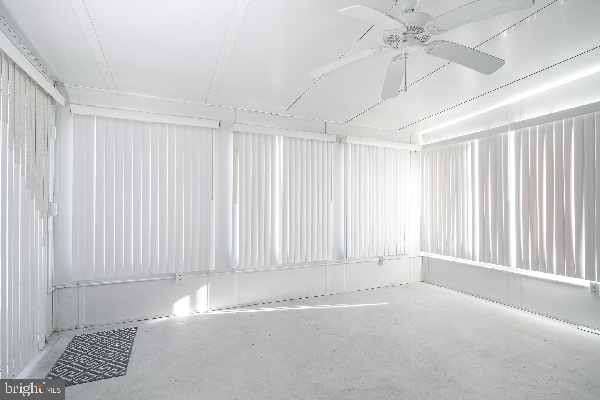 160 Gunwale Road Manahawkin, NJ 08050 - Photo 24 of 27 an empty room with windows and fan
