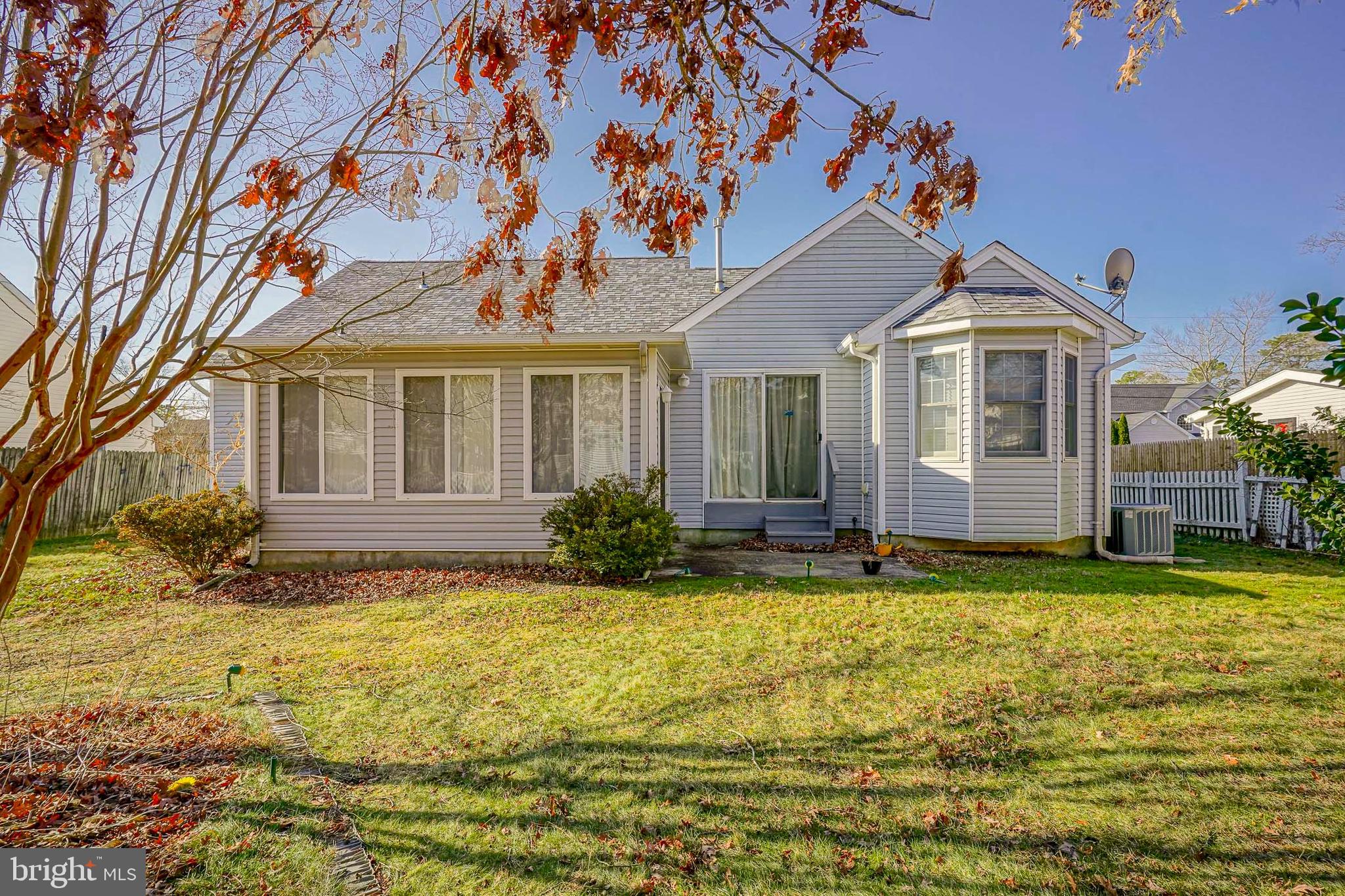 160 Gunwale Road Manahawkin, NJ 08050 - Photo 25 of 27 a front view of a house with a yard