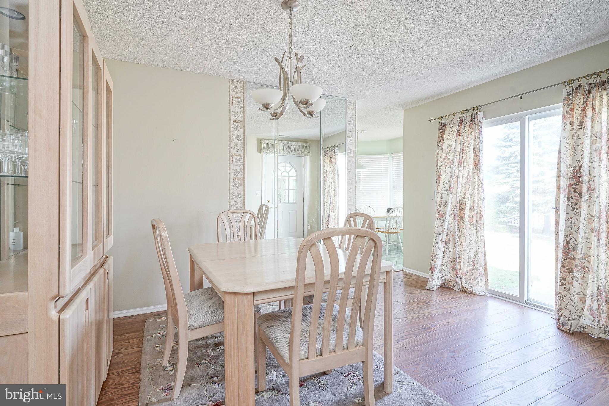 160 Gunwale Road Manahawkin, NJ 08050 - Photo 7 of 27 a view of a dining room with furniture window and wooden floor