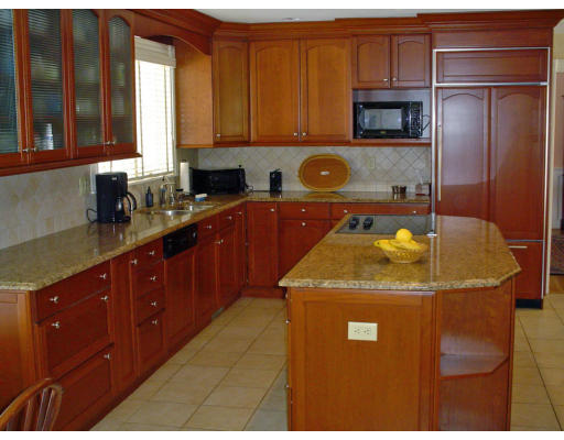53 White Oak Road Wellesley, MA 02481 - Photo 2 of 9 a kitchen with a sink a stove and cabinets