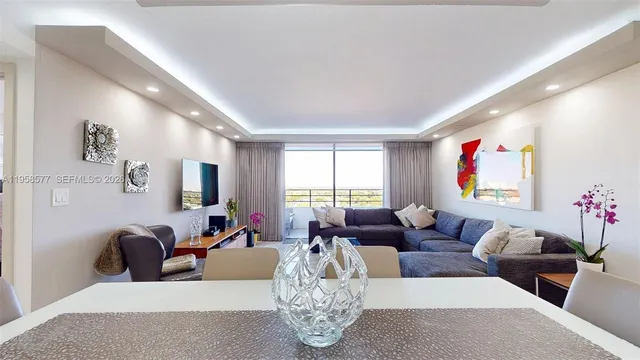 a living room with furniture or couch and a large window