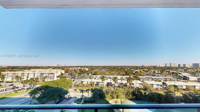 a large kitchen with kitchen island a sink table and chairs