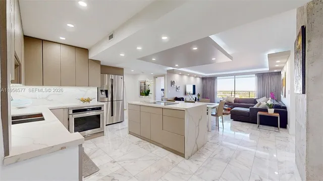 a kitchen with a sink stove and refrigerator