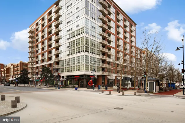 a view of tall building with large windows