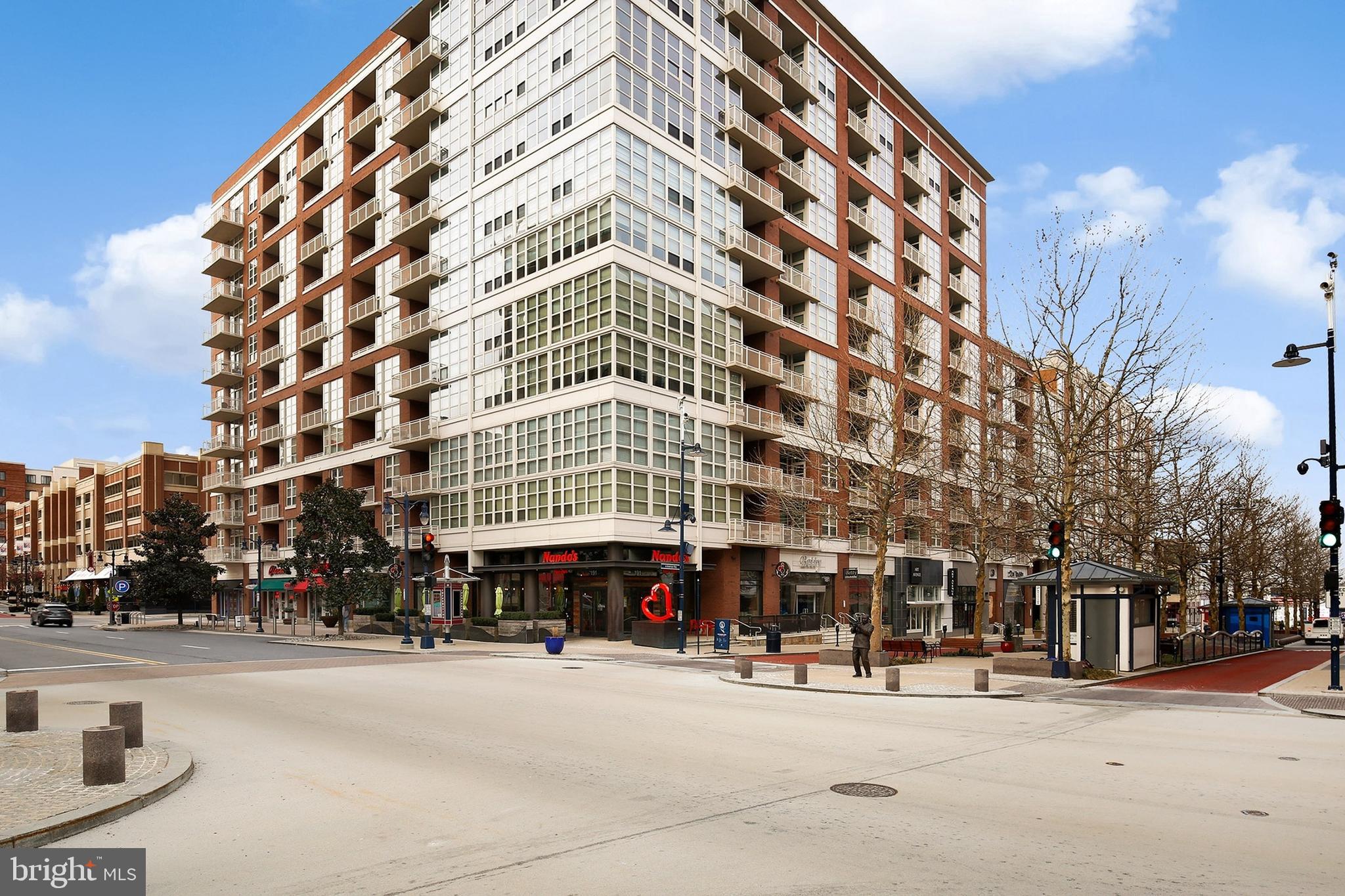 157 Fleet Street, Unit 1001 Oxon Hill, MD 20745 - Photo 1 of 24 a view of tall building with large windows
