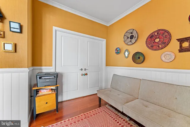 a living room with a couch and dresser