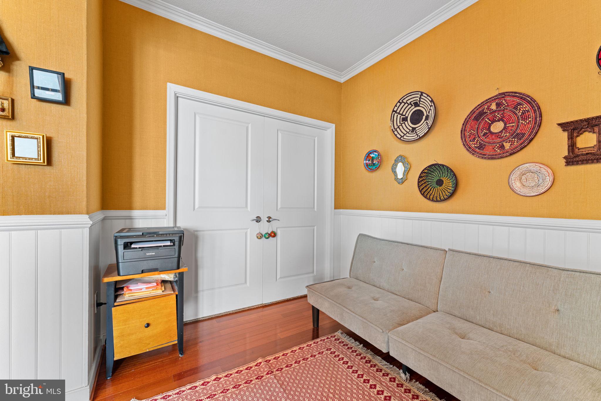 157 Fleet Street, Unit 1001 Oxon Hill, MD 20745 - Photo 13 of 24 a living room with a couch and dresser