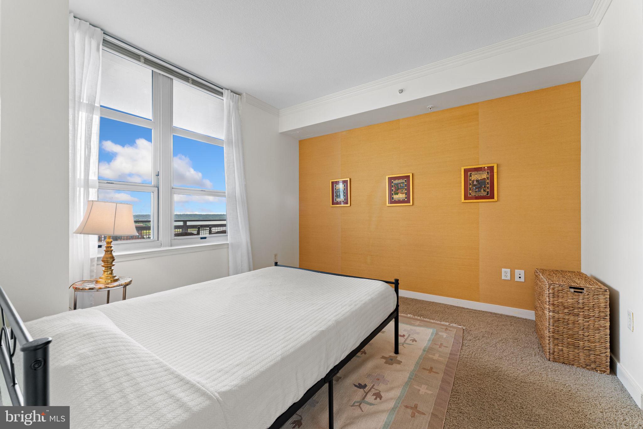 157 Fleet Street, Unit 1001 Oxon Hill, MD 20745 - Photo 15 of 24 a bedroom with a bed and a window