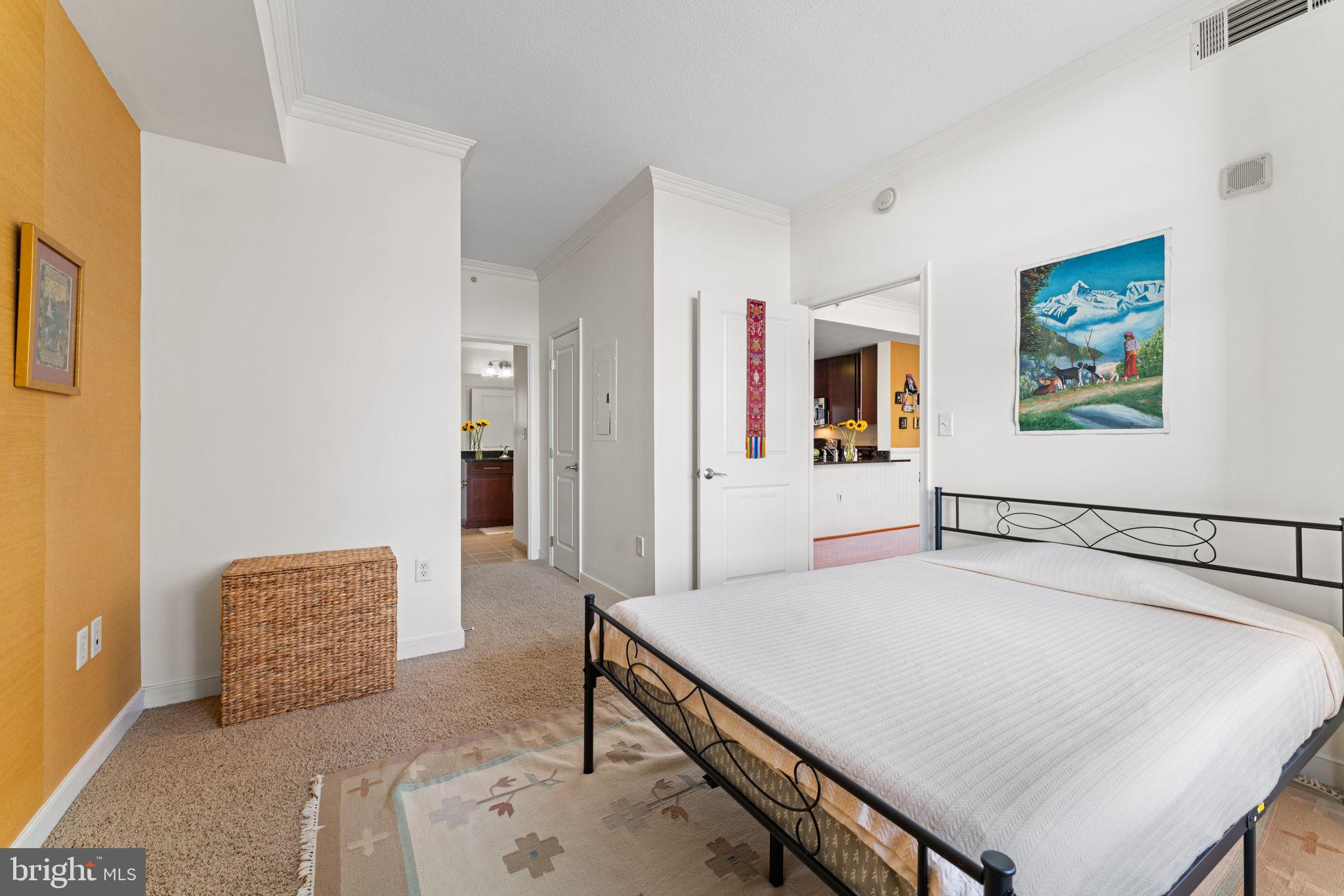 157 Fleet Street, Unit 1001 Oxon Hill, MD 20745 - Photo 16 of 24 a living room with furniture and a table