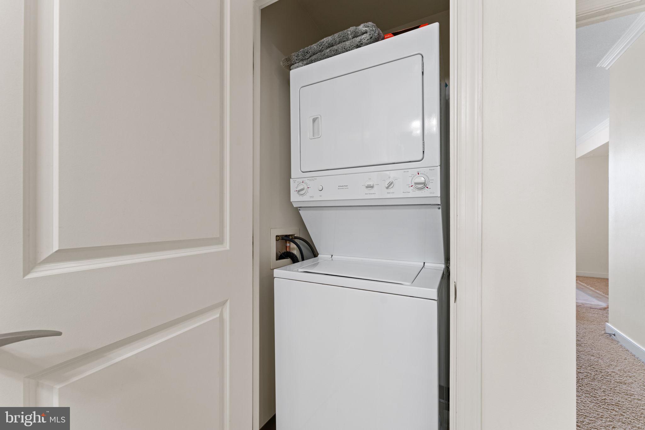 157 Fleet Street, Unit 1001 Oxon Hill, MD 20745 - Photo 20 of 24 a utility room with dryer and washer