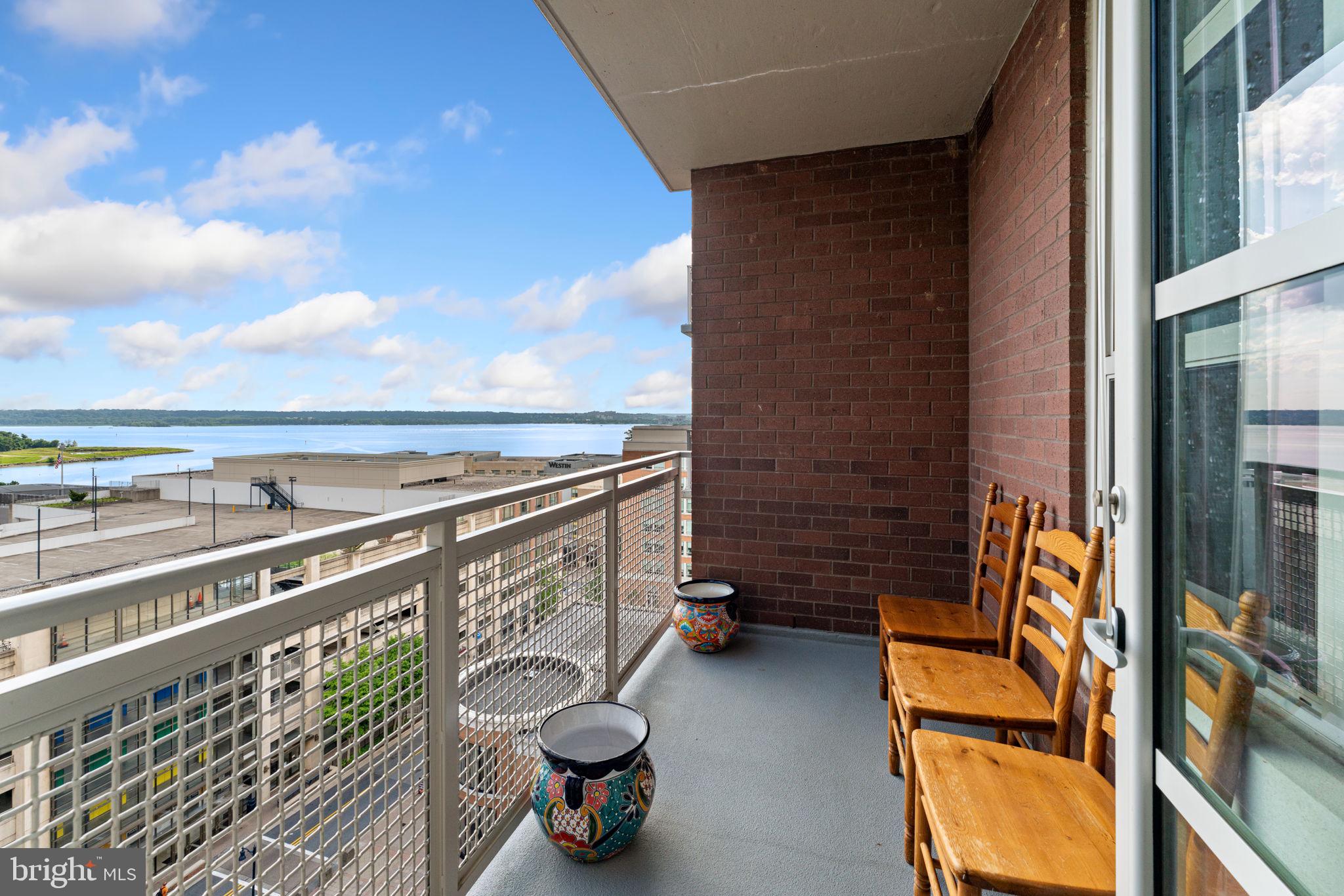 157 Fleet Street, Unit 1001 Oxon Hill, MD 20745 - Photo 21 of 24 a view of roof deck with chair and wooden floor