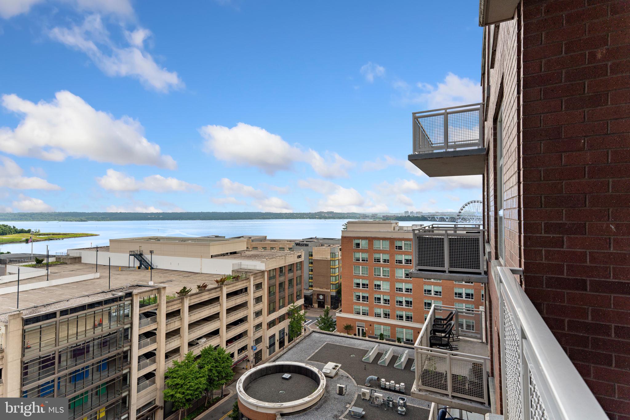 157 Fleet Street, Unit 1001 Oxon Hill, MD 20745 - Photo 22 of 24 a view of a balcony with furniture and city view