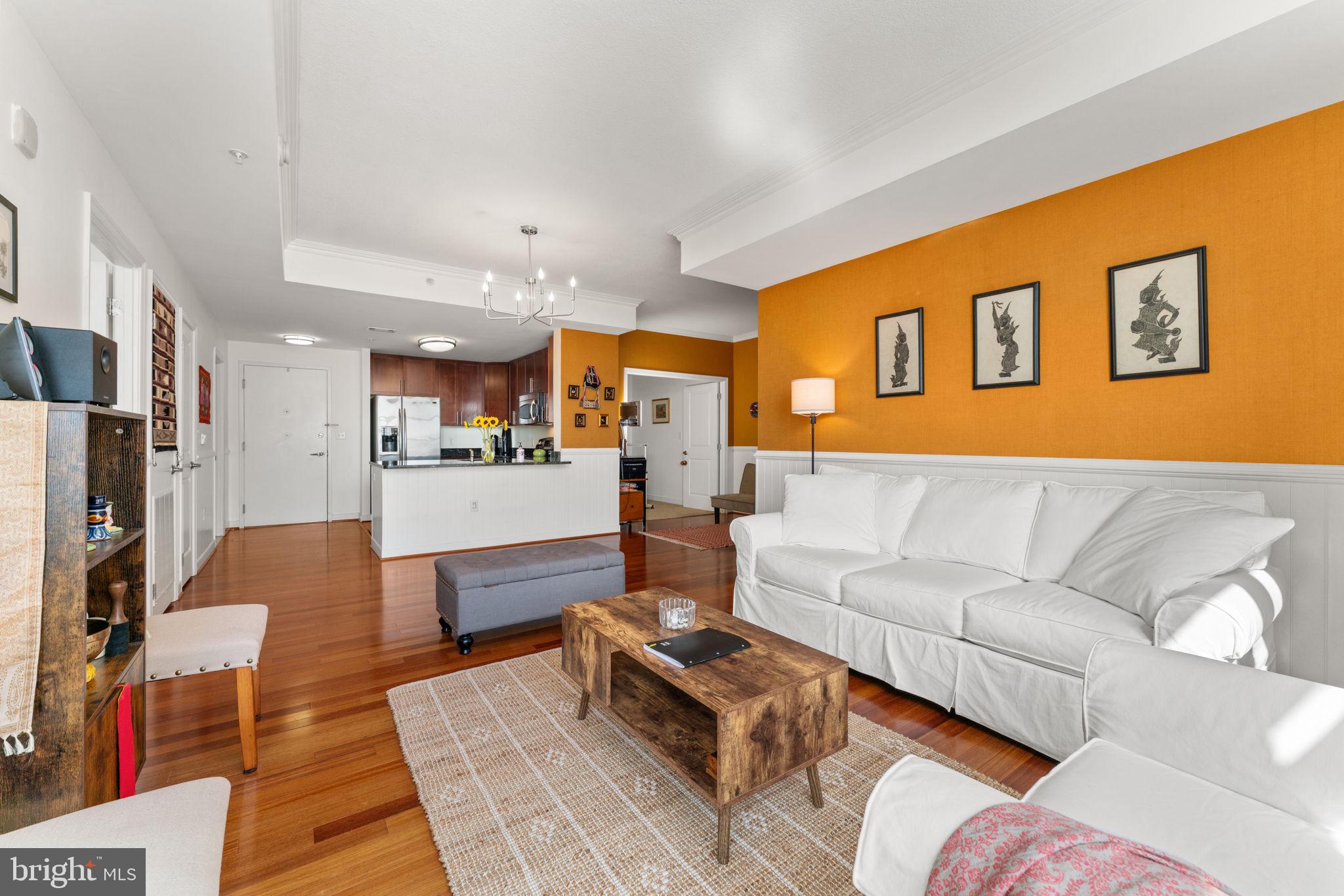 157 Fleet Street, Unit 1001 Oxon Hill, MD 20745 - Photo 8 of 24 a living room with furniture and kitchen view