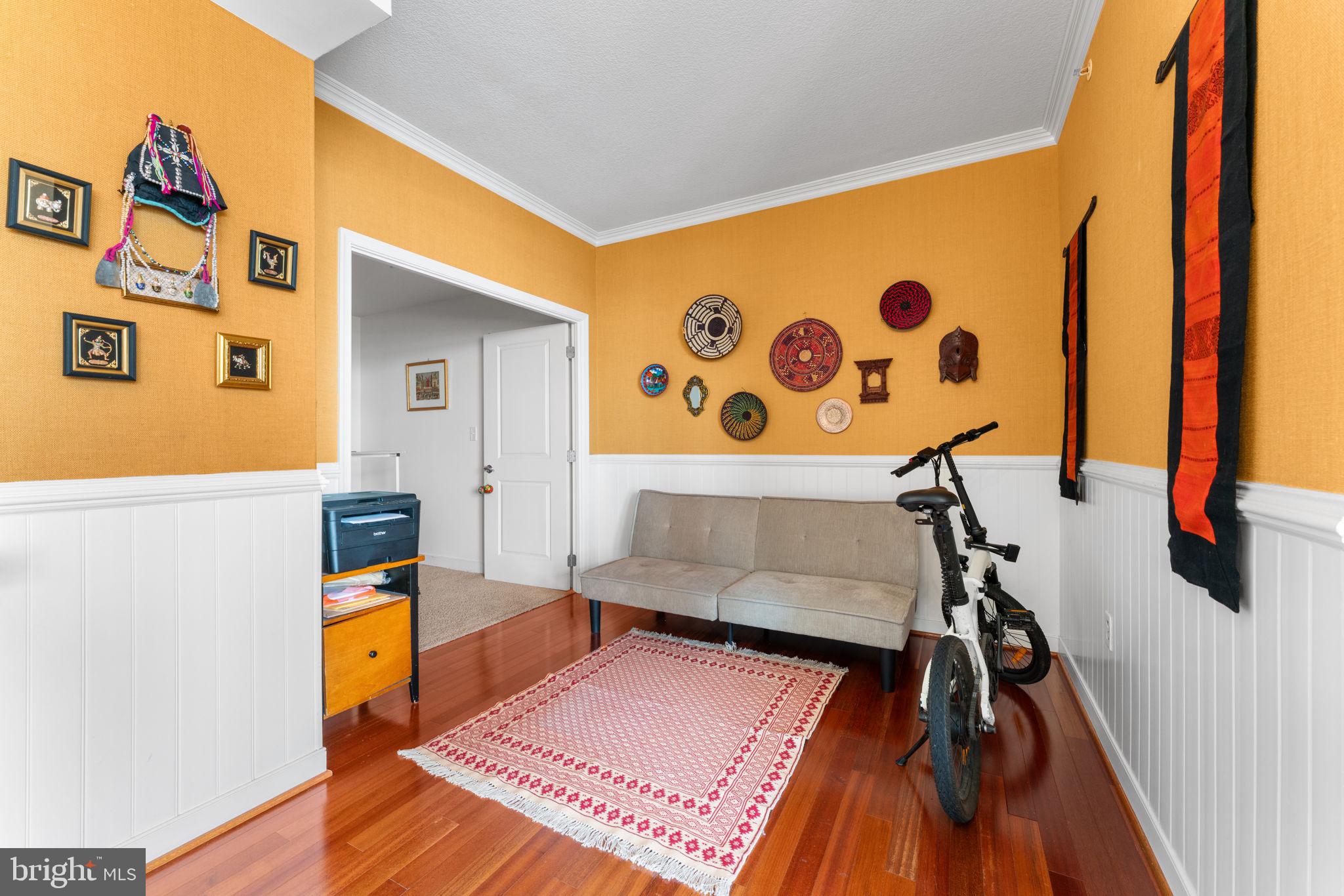 157 Fleet Street, Unit 1001 Oxon Hill, MD 20745 - Photo 10 of 24 a living room with a couch and a table