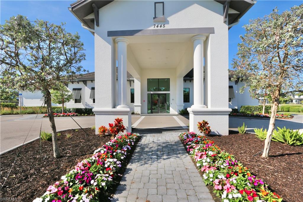 View of exterior entry with stucco siding