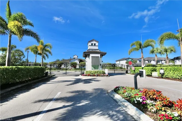 a front view of a house with a yard and outdoor seating