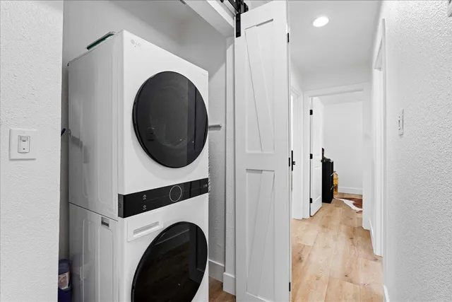 a view of a hallway with washer and dryer