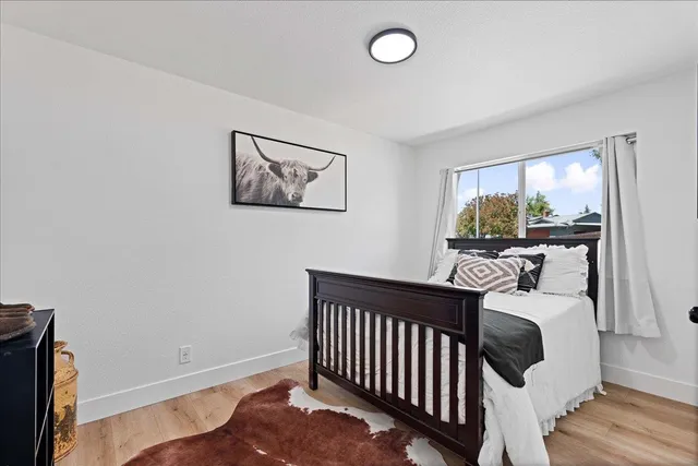 a bedroom with furniture and a window