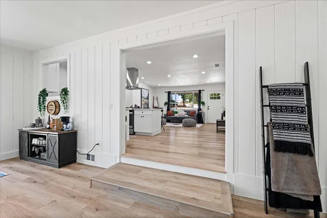 a view of a house with a yard and sitting area
