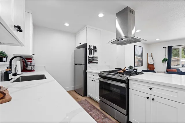 a kitchen with a stove and a sink