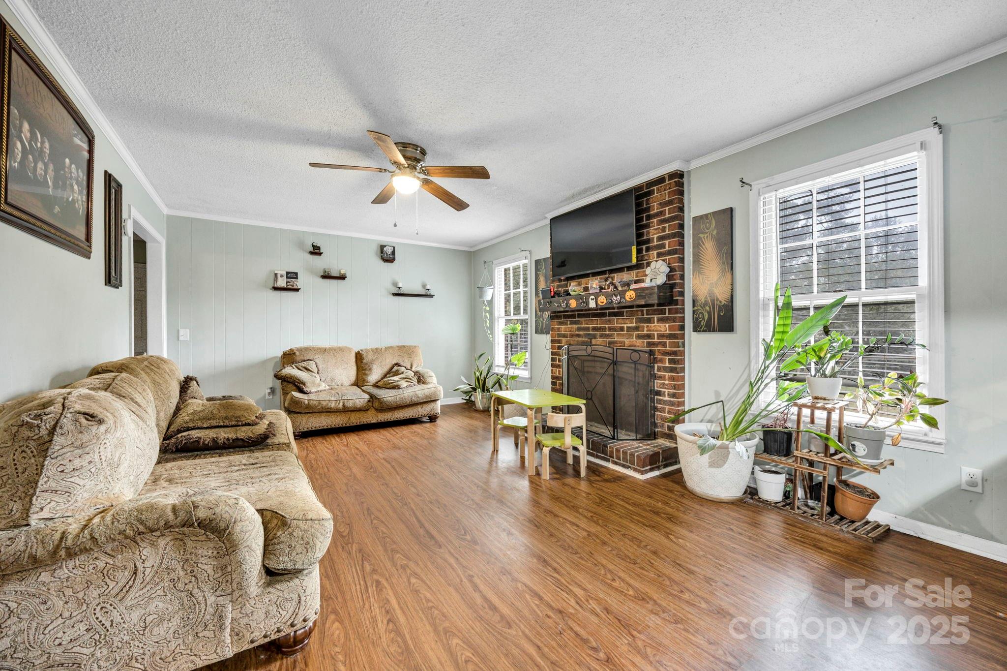 403 Ravenscroft Road West Columbia, SC 29172 - Photo 11 of 33 a living room with fireplace furniture and a flat screen tv