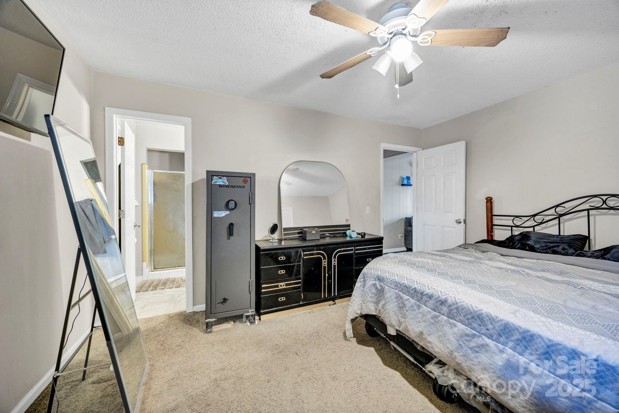 403 Ravenscroft Road West Columbia, SC 29172 - Photo 17 of 33 a bedroom with a bed and a chandelier