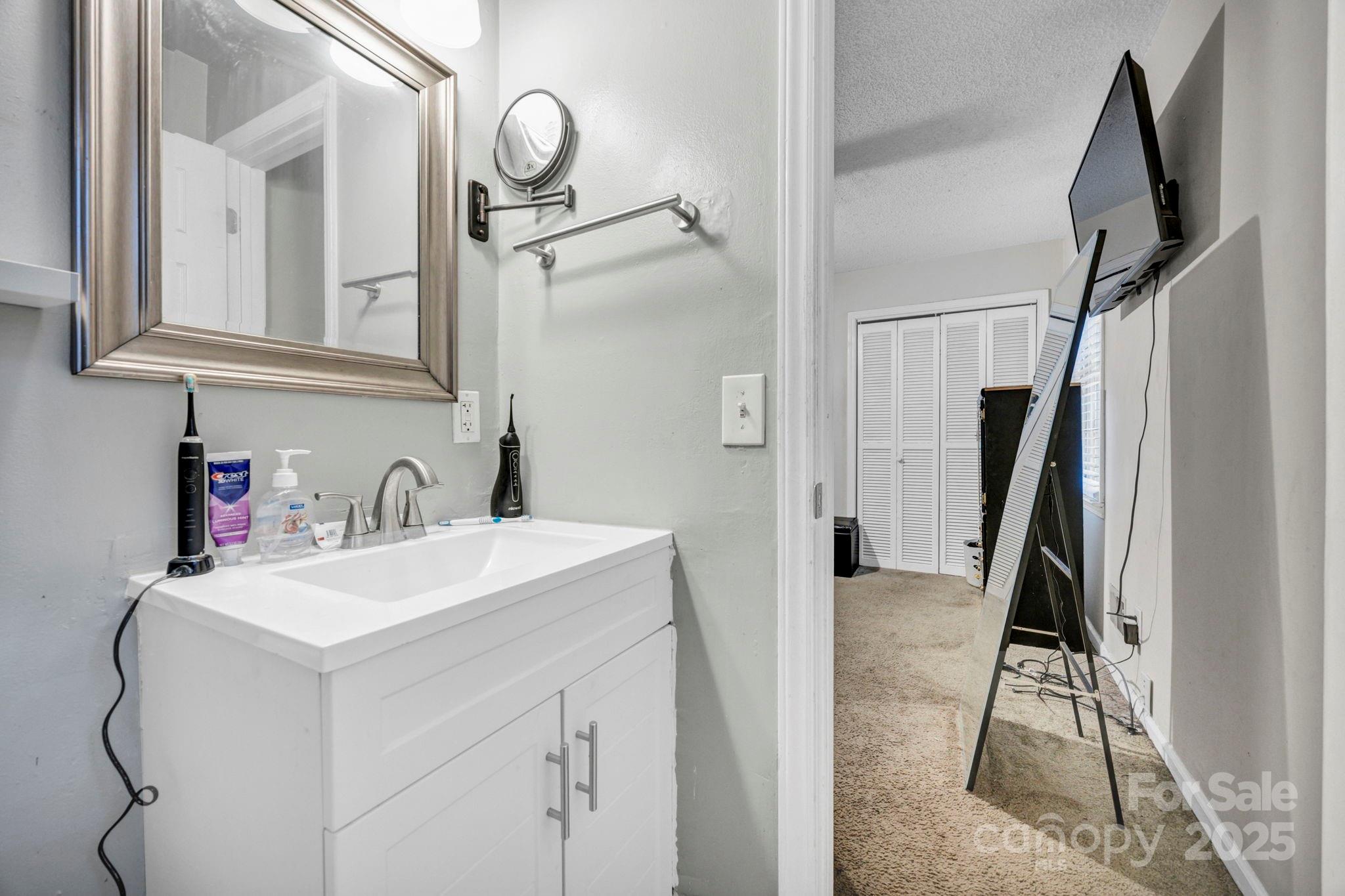 403 Ravenscroft Road West Columbia, SC 29172 - Photo 20 of 33 a bathroom with a sink vanity and a mirror