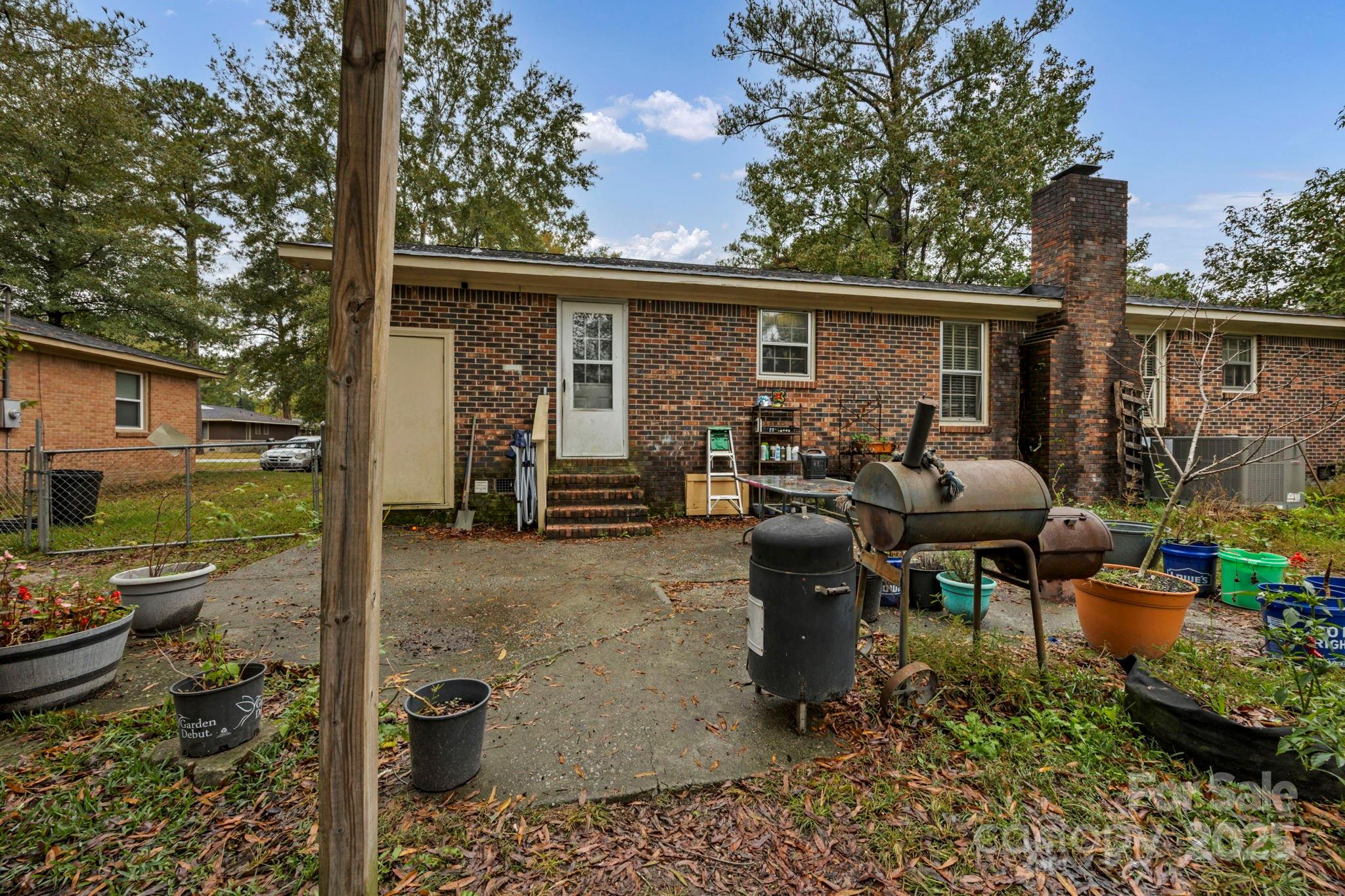 403 Ravenscroft Road West Columbia, SC 29172 - Photo 27 of 33 a view of a patio with chairs and potted plants