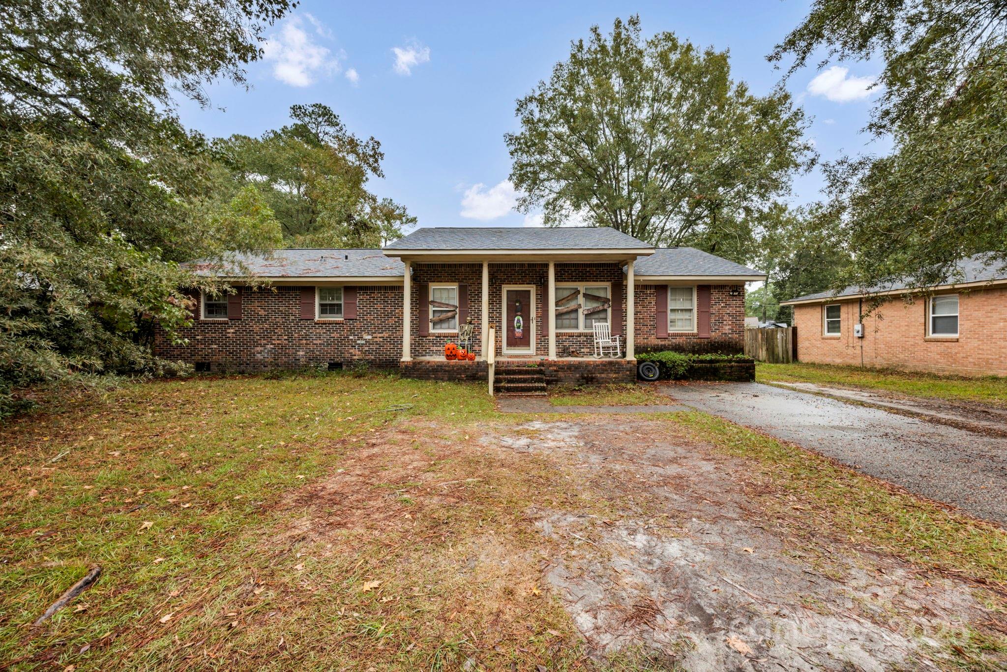 403 Ravenscroft Road West Columbia, SC 29172 - Photo 33 of 33 a view of a house with a backyard and a patio