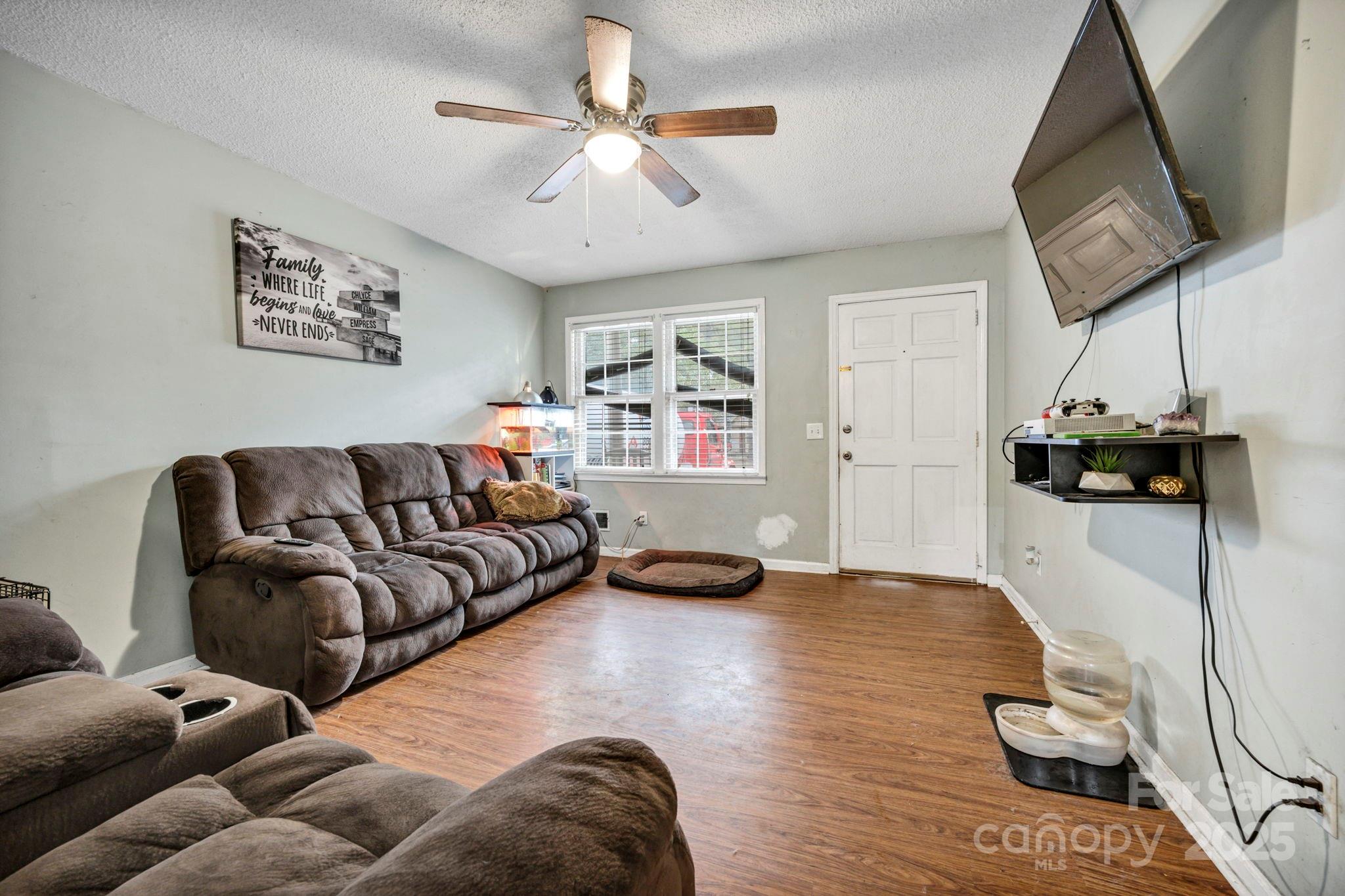 403 Ravenscroft Road West Columbia, SC 29172 - Photo 4 of 33 a living room with furniture and a flat screen tv