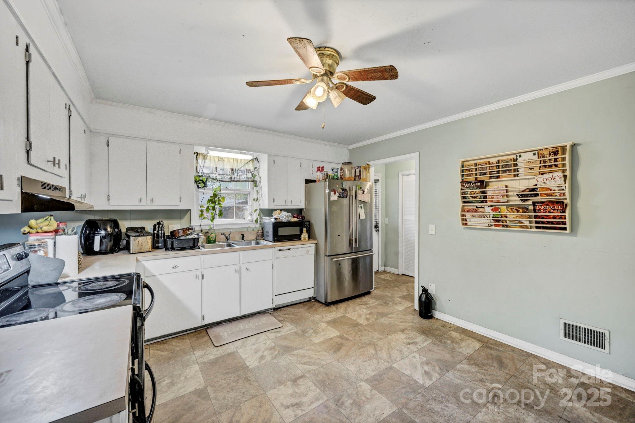 403 Ravenscroft Road West Columbia, SC 29172 - Photo 5 of 33 a kitchen with stainless steel appliances granite countertop a refrigerator sink and cabinets
