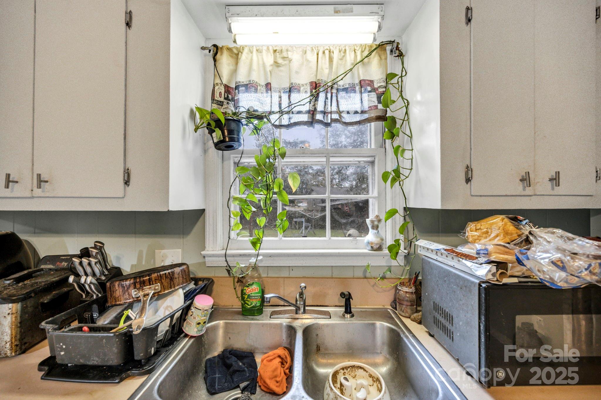 403 Ravenscroft Road West Columbia, SC 29172 - Photo 9 of 33 a kitchen with a sink stove and cabinets