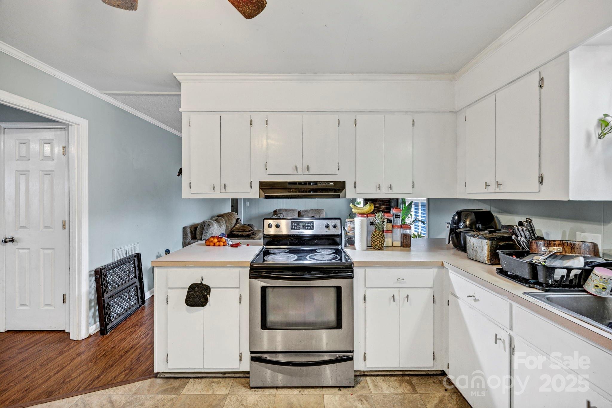403 Ravenscroft Road West Columbia, SC 29172 - Photo 10 of 33 a kitchen with white cabinets and white appliances