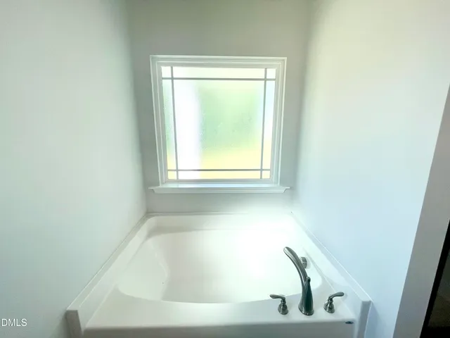 a bathroom with a glass shower door